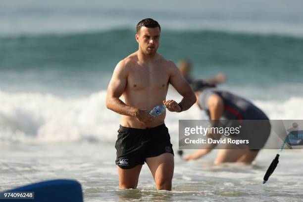 George Ford walks out of the Indian Ocean during the England recovery session held on the beach on June 14, 2018 in Umhlanga Rocks, South Africa.
