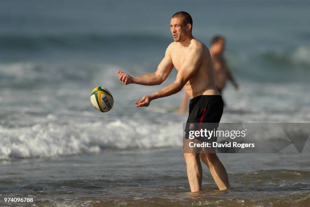 Mike Brown passes the ball during the England recovery session held on the beach on June 14, 2018 in Umhlanga Rocks, South Africa.