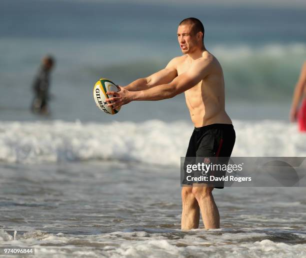 Mike Brown passes the ball during the England recovery session held on the beach on June 14, 2018 in Umhlanga Rocks, South Africa.