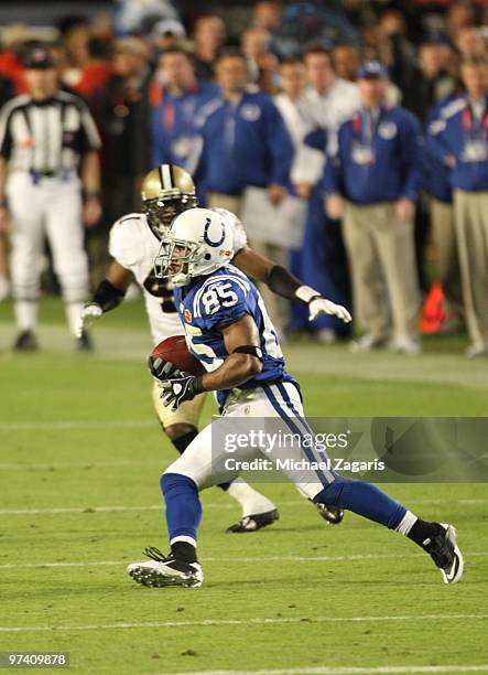 Pierre Garcon of the Indianapolis Colts runs the ball after making a reception during Super Bowl XLIV against the New Orleans Saints at Sun Life...
