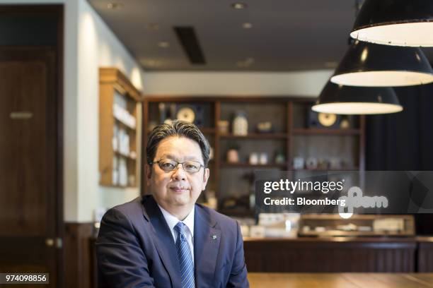 Masamichi Terabatake, president and chief executive officer of Japan Tobacco Inc., poses for a photograph in a smoking lounge at the company's...