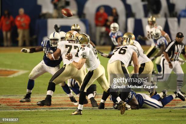 Drew Brees of the New Orleans Saints passes the ball during Super Bowl XLIV against the Indianapolis Colts at Sun Life Stadium on February 7, 2010 in...