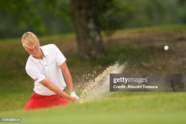 Sebastian Friedrichsen of Denmark hits from a bunker on the 13th hole during the third round of the Toyota Junior Golf World Cup at Chukyo Golf Club...