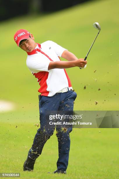 Ryo Hisatsune of Japan hits his second shot on the 13th hole during the third round of the Toyota Junior Golf World Cup at Chukyo Golf Club on June...