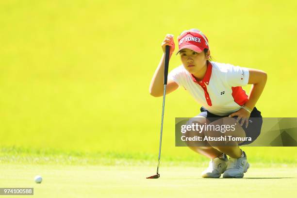 Yuna Nishimura of Japan lines up her putt on the 2nd hole during the third round of the Toyota Junior Golf World Cup at Chukyo Golf Club on June 14,...