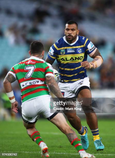 Manu Ma'u of the Eels runs at Adam Reynolds of the Rabbitohs during the round 15 NRL match between the Parramatta Eels and the South Sydney Rabbitohs...