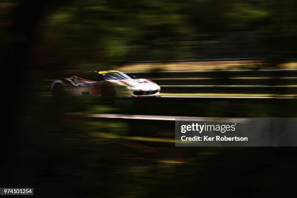 The MR Racing Ferrari 488 GTE of Motoaki Ishikawa, Olivier Beretta and Eddie Cheever drives during practice for the Le Mans 24 Hour race at the...