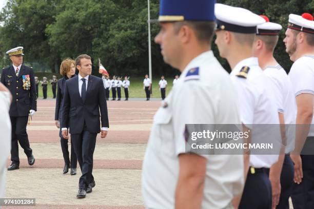 French President Emmanuel Macron , Defence Minister Florence Parly and French Air Force chief of military staff, general Andre Lanata, review troops...