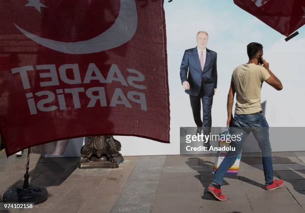 Campaign posters of presidential candidates are seen at Kizilay square in Ankara, Turkey on June 13, 2018. Political party officers distributed...