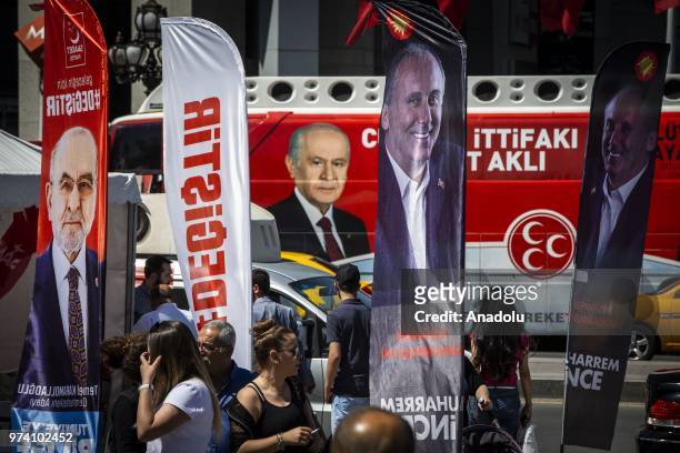 Campaign posters of presidential candidates and flags of parties are seen at Kizilay square in Ankara, Turkey on June 13, 2018. Political party...