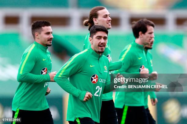 Australia's midfielder Dimitri Petratos runs with teammates during a training session in Kazan on June 14 ahead of the Russia 2018 World Cup football...