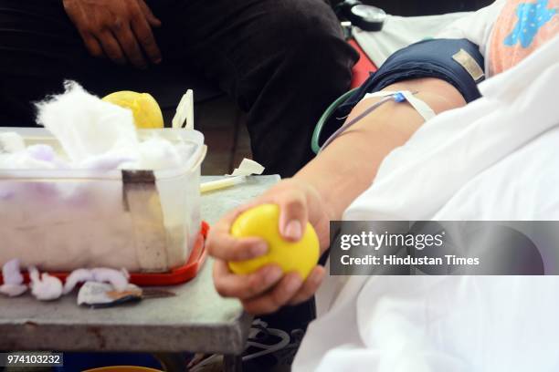 People donate their blood at Sasoon Hospital ahead of World Blood Donor Day, on June 13, 2018 in Pune, India. Every year on June 14, countries around...