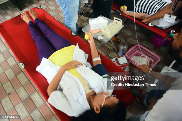 People donate their blood at Sasoon Hospital ahead of World Blood Donor Day, on June 13, 2018 in Pune, India. Every year on June 14, countries around...