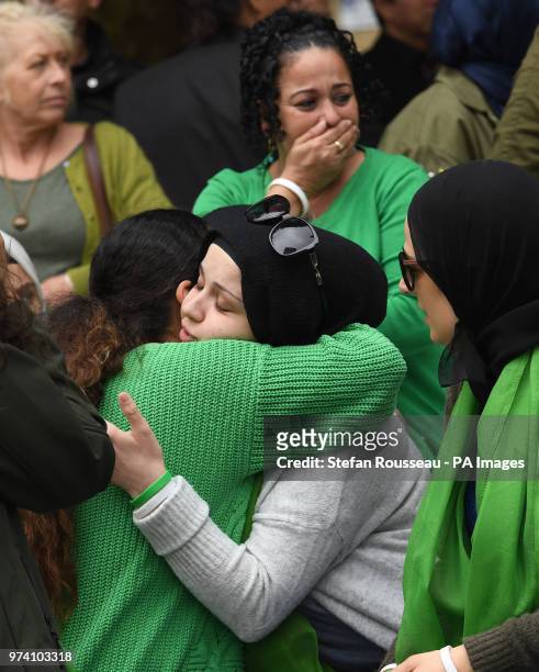 People arrive for the Grenfell Tower anniversary national minute silence and mosaic unveiling at the base of Grenfell Tower in west London to mark a...