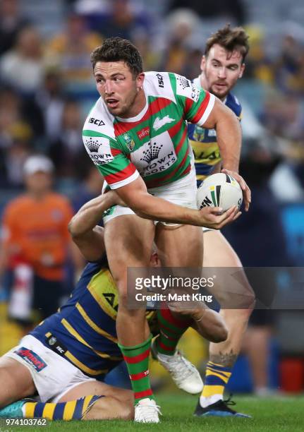 Sam Burgess of the Rabbitohs is tackled during the round 15 NRL match between the Parramatta Eels and the South Sydney Rabbitohs at ANZ Stadium on...