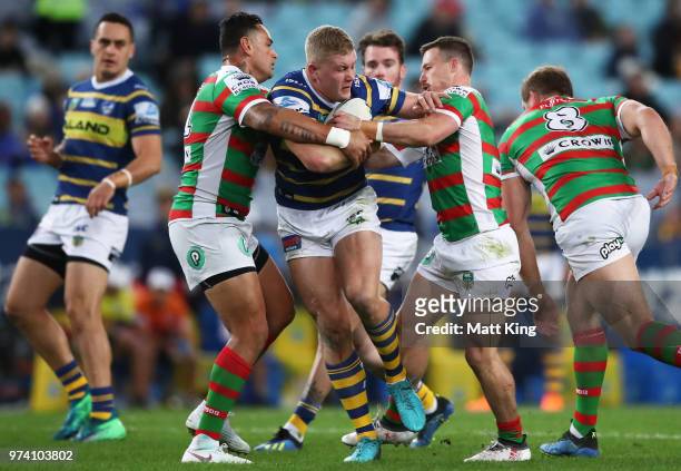 Daniel Alvaro of the Eels is tackled during the round 15 NRL match between the Parramatta Eels and the South Sydney Rabbitohs at ANZ Stadium on June...
