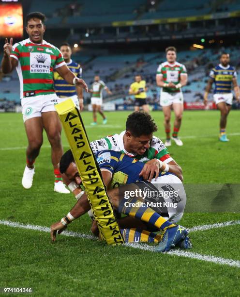 Josh Hoffman of the Eels is tackled over the sideline by Dane Gagai of the Rabbitohs during the round 15 NRL match between the Parramatta Eels and...