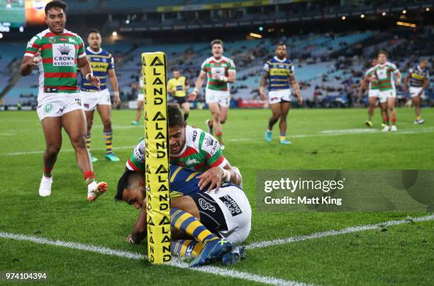 Josh Hoffman of the Eels is tackled over the sideline by Dane Gagai of the Rabbitohs during the round 15 NRL match between the Parramatta Eels and...