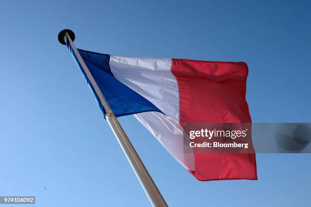 The French national flag flies from a flagpole in the harbour at Villefranche-sur-Mer, on the Cote d'Azur, in France, on Thursday, May 31, 2018....