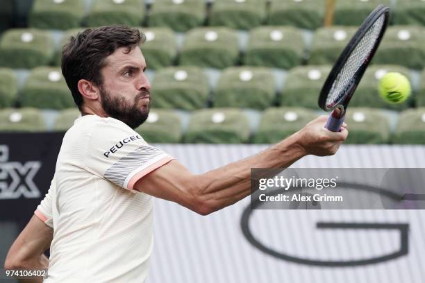 Gilles Simon of France plays a forehand to Feliciano Lopez of Spain during day 4 of the Mercedes Cup at Tennisclub Weissenhof on June 14, 2018 in...