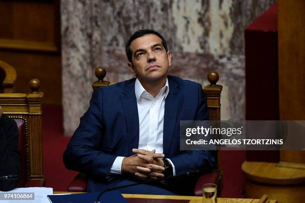 Greek Prime Minister Alexis Tsipras attends a parliamentary session in Athens on June 14, 2018 as the Greek opposition calls a censure vote against...