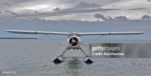 seaplane taking off from water - the penrose stock pictures, royalty-free photos & images