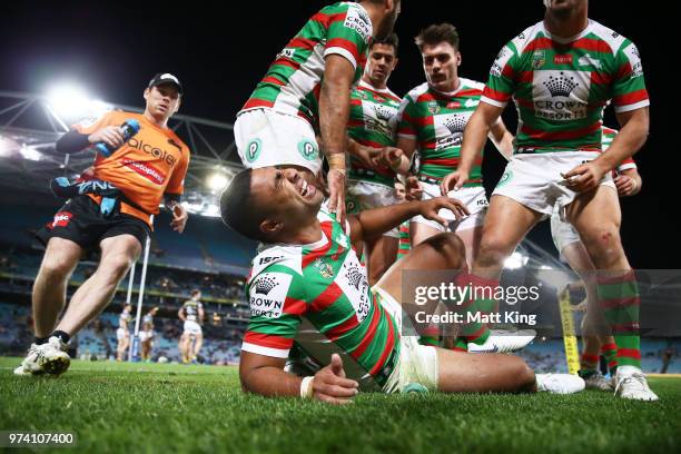 Robert Jennings of the Rabbitohs lies doen injured after scoring a try in the corner during the round 15 NRL match between the Parramatta Eels and...
