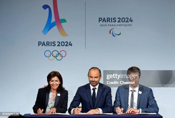 Paris city mayor Anne Hidalgo , French Prime Minister Edouard Philippe and International Olympic Committee member and Co-Chairman of Paris 2024 Tony...