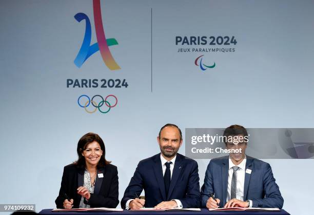 Paris city mayor Anne Hidalgo , French Prime Minister Edouard Philippe and International Olympic Committee member and Co-Chairman of Paris 2024 Tony...