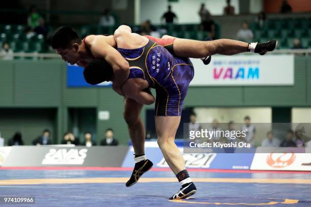 Masato Sumi competes against Taichi Oka in the Men's Greco-Roman style 87kg final on day one of the All Japan Wrestling Invitational Championships at...