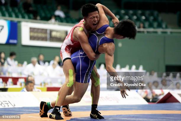 Katsuaki Endo competes against Ryo Matsui in the Men's Greco-Roman style 63kg final on day one of the All Japan Wrestling Invitational Championships...
