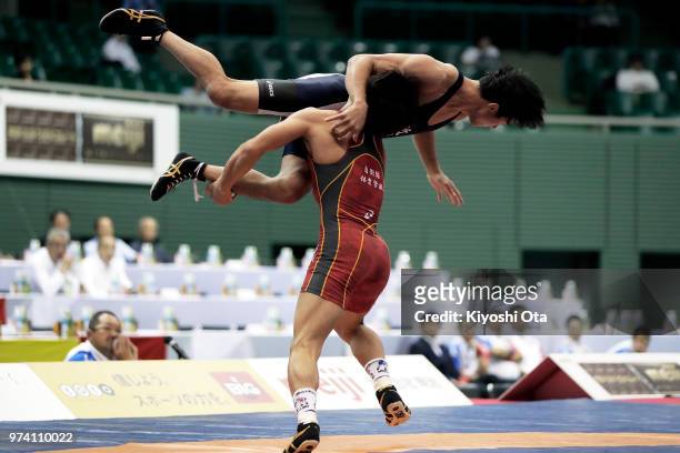 Kazuya Koyanagi competes against Shingo Arimoto in the Men's Freestyle 61kg final on day one of the All Japan Wrestling Invitational Championships at...