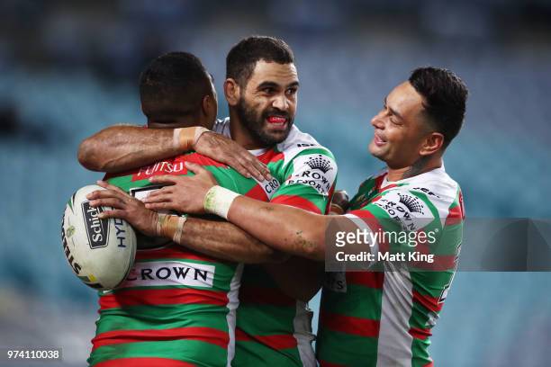 Robert Jennings of the Rabbitohs celebrates with Greg Inglis and John Sutton after scoring a try during the round 15 NRL match between the Parramatta...