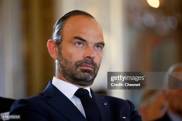 French Prime Minister Edouard Philippe listens to Paris city mayor Anne Hidalgo's speech before the signing of the 2024 Olympic and Paralympic Games...