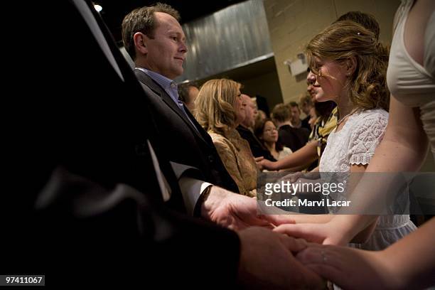 Scott Forhetz places the ring on his daughter's left ring finger during a purity ring ceremony on February 13, 2008 at the Full Life Assembly of God...