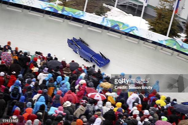 Winter Olympics: Great Britain Team 1 John Jackson, Allyn Condon, Dan Money and Henry Odili Nwume overturns during Men's Bobsled Four Man Heat 2 at...