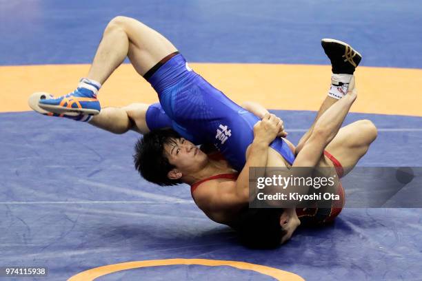 Kazuya Koyanagi competes against Raimu Maeda in the Men's Freestyle 61kg second round match on day one of the All Japan Wrestling Invitational...