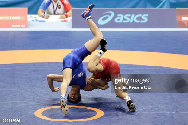 Kazuya Koyanagi competes against Raimu Maeda in the Men's Freestyle 61kg second round match on day one of the All Japan Wrestling Invitational...