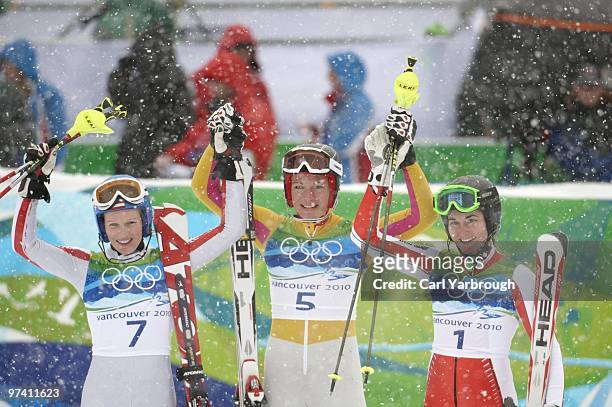 Winter Olympics: Austria Marlies Schild , Germany Maria Riesch , and Czech Republic Sarka Zahrobska victorious after winning Women's Slalom 2nd Run...