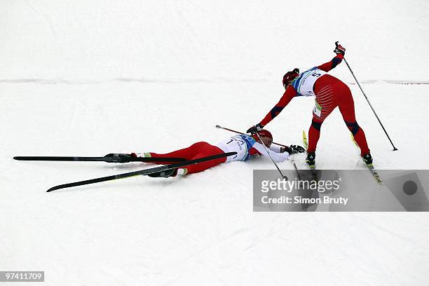 Winter Olympics: Poland Justyna Kowalczyk and Norway Marit Bjoergen victorious after winning Women's 30K Mass Start Classic at Whistler Olympic Park....