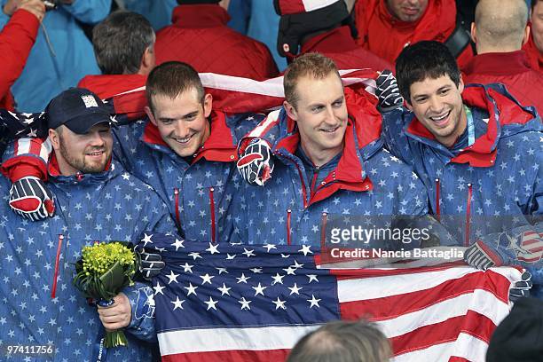 Winter Olympics: Team USA 1 Steven Holcomb, Justin Olsen, Curtis Tomasevicz, and Steve Mesler victorious after winning Men's Bobsled Four Man Final...