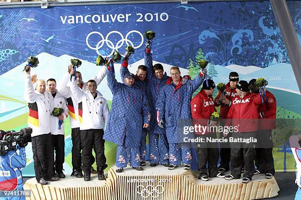 Winter Olympics: Germany Team 1 Andre Lange, Kevin Kuske, Alexander Roediger, and Martin Putze , USA Team 1 Steven Holcomb, Steve Mesler, Curtis...