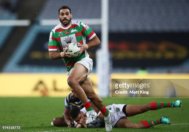 Greg Inglis of the Rabbitohs makes a break during the round 15 NRL match between the Parramatta Eels and the South Sydney Rabbitohs at ANZ Stadium on...