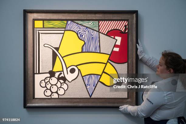 An art handler adjusts 'Cubist still life' by Roy Lichtenstein during a preview of the Contemporary Art sale at Sotheby's on June 14, 2018 in London,...