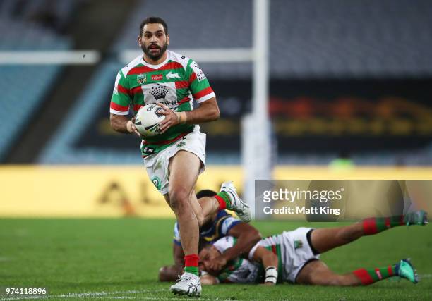 Greg Inglis of the Rabbitohs makes a break during the round 15 NRL match between the Parramatta Eels and the South Sydney Rabbitohs at ANZ Stadium on...