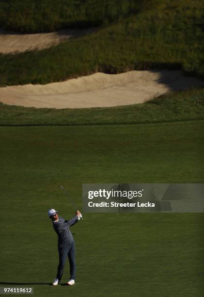 Paul Casey of England plays his second shot on the tenth hole during the first round of the 2018 U.S. Open at Shinnecock Hills Golf Club on June 14,...