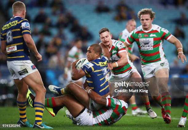 Peni Terepo of the Eels is tackled during the round 15 NRL match between the Parramatta Eels and the South Sydney Rabbitohs at ANZ Stadium on June...