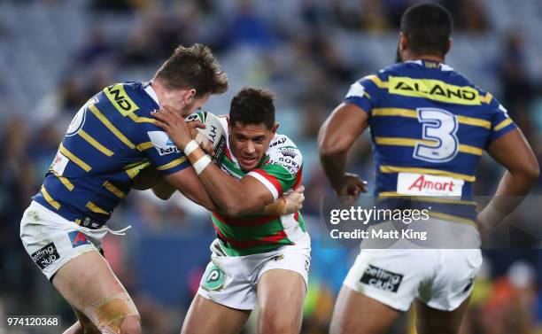 Dane Gagai of the Rabbitohs is tackled during the round 15 NRL match between the Parramatta Eels and the South Sydney Rabbitohs at ANZ Stadium on...