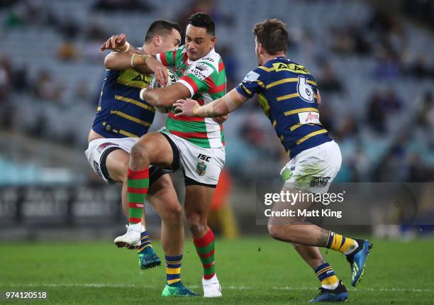 John Sutton of the Rabbitohs is tackled during the round 15 NRL match between the Parramatta Eels and the South Sydney Rabbitohs at ANZ Stadium on...