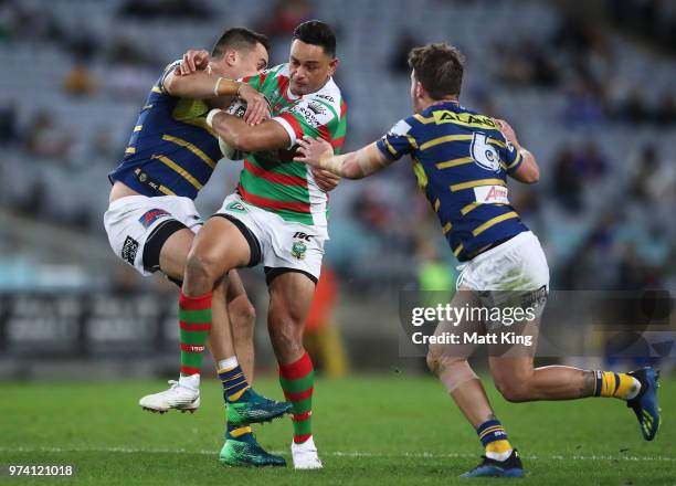 John Sutton of the Rabbitohs is tackled during the round 15 NRL match between the Parramatta Eels and the South Sydney Rabbitohs at ANZ Stadium on...